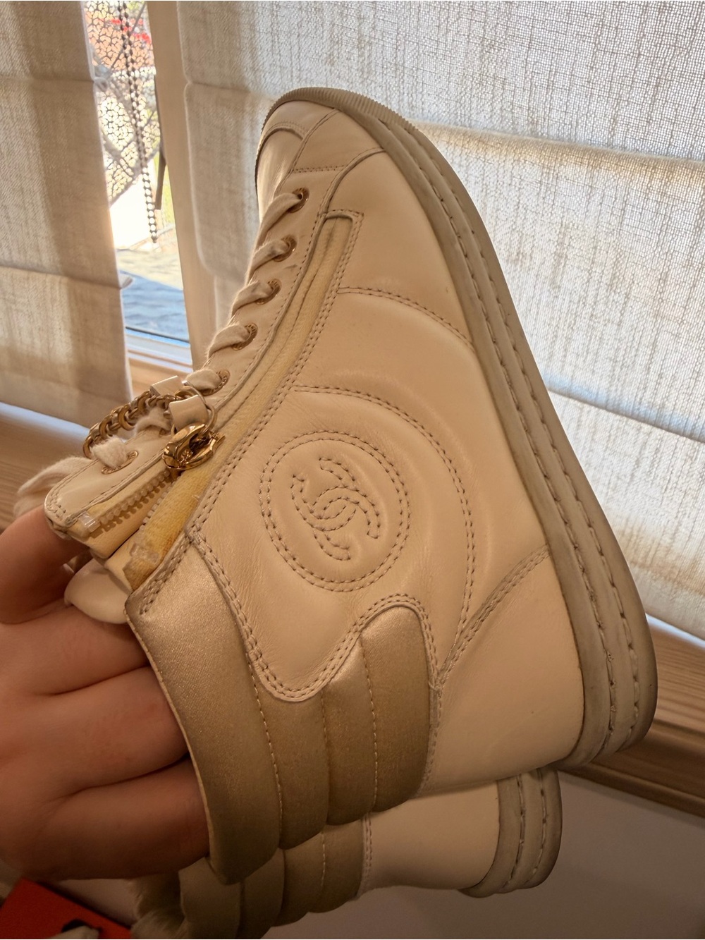 CHANEL Cream High-Top Sneaker with Gold Trim